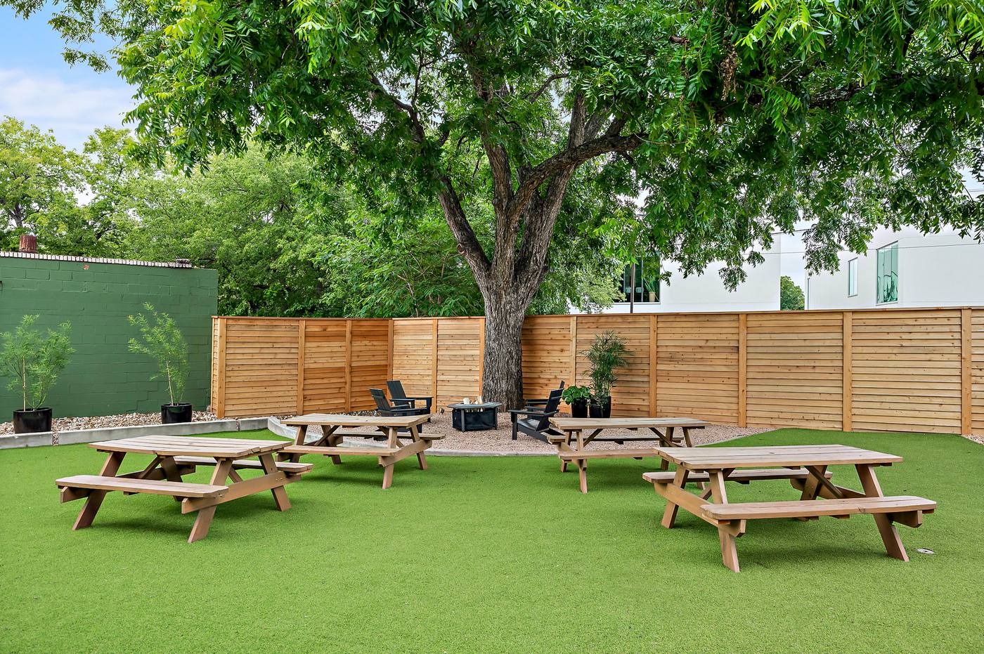 The turfed lawn with picnic tables