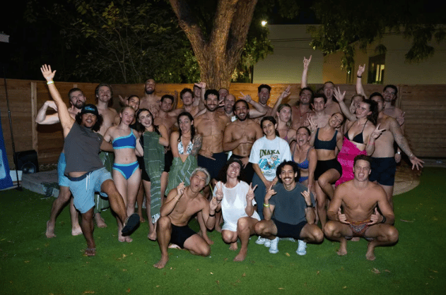 Sauna and cold plunge social under the courtyard tree at night