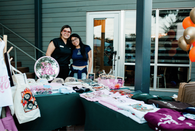 Vendor merchandise table at a Webber East event