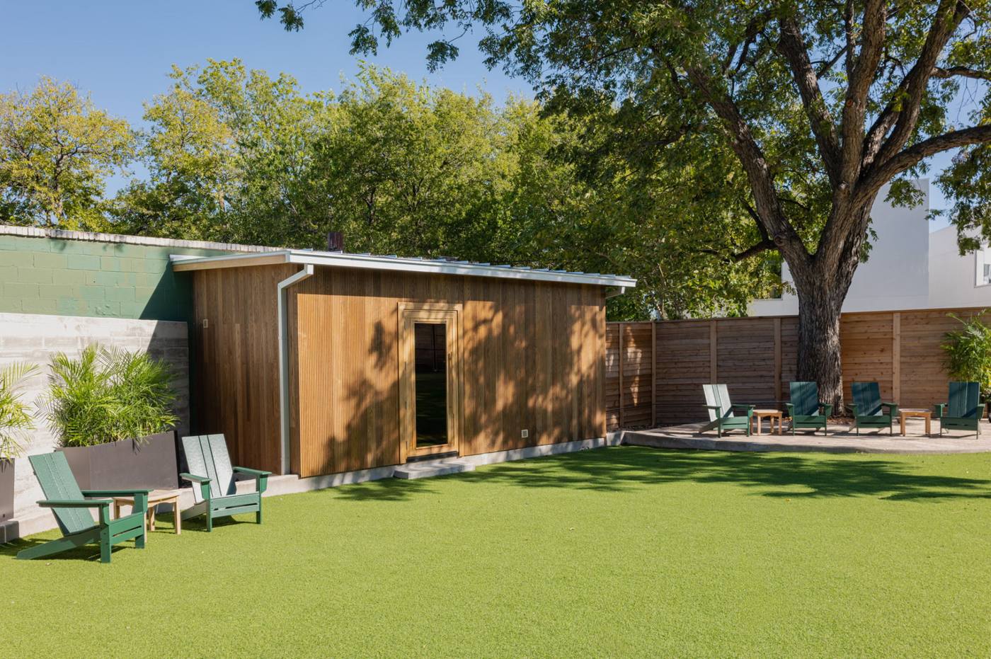 The sauna and lawn from the courtyard