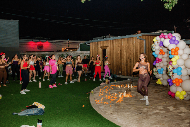 Nighttime group fitness event with candles