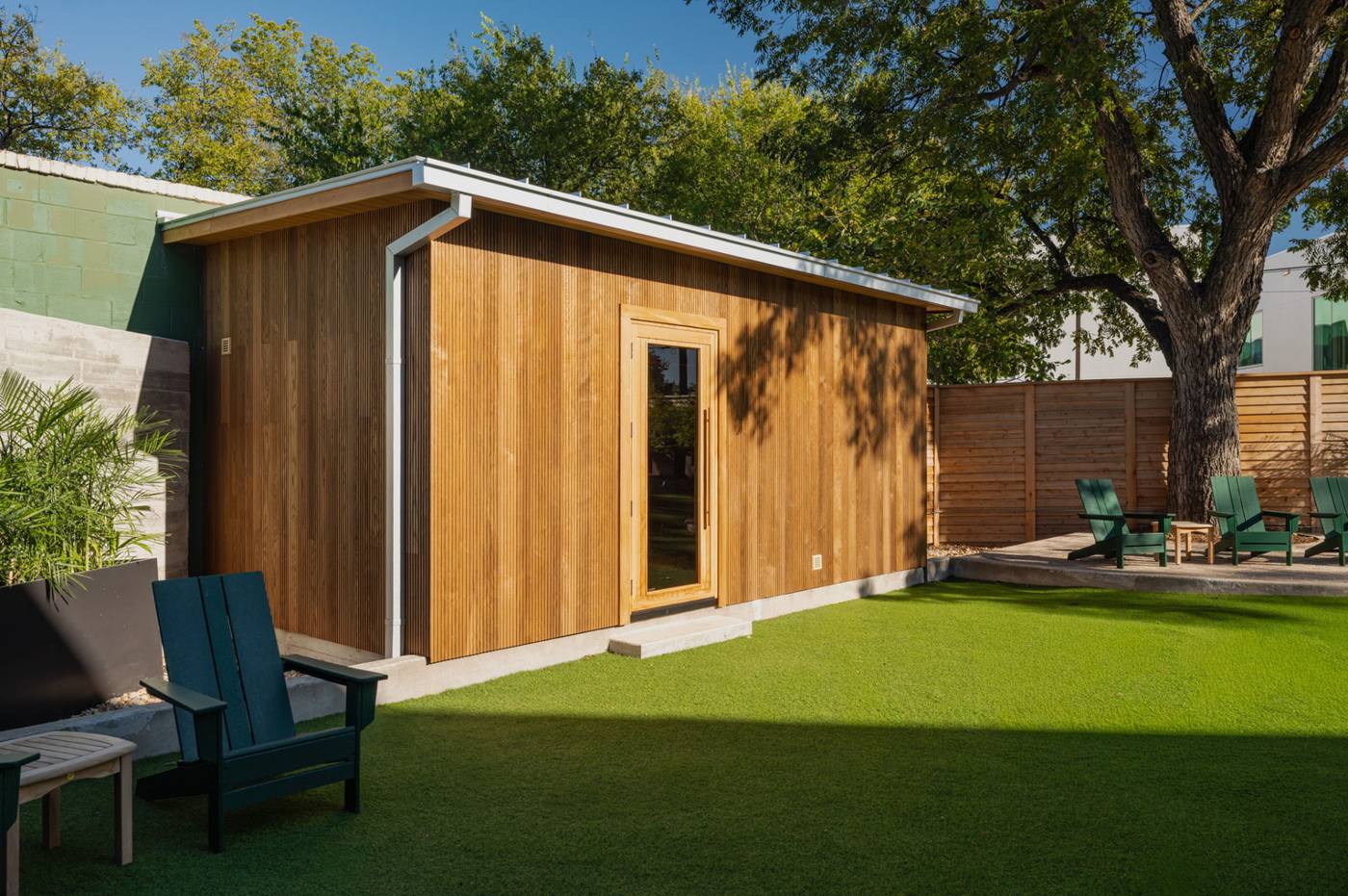 The custom cedar sauna at dusk