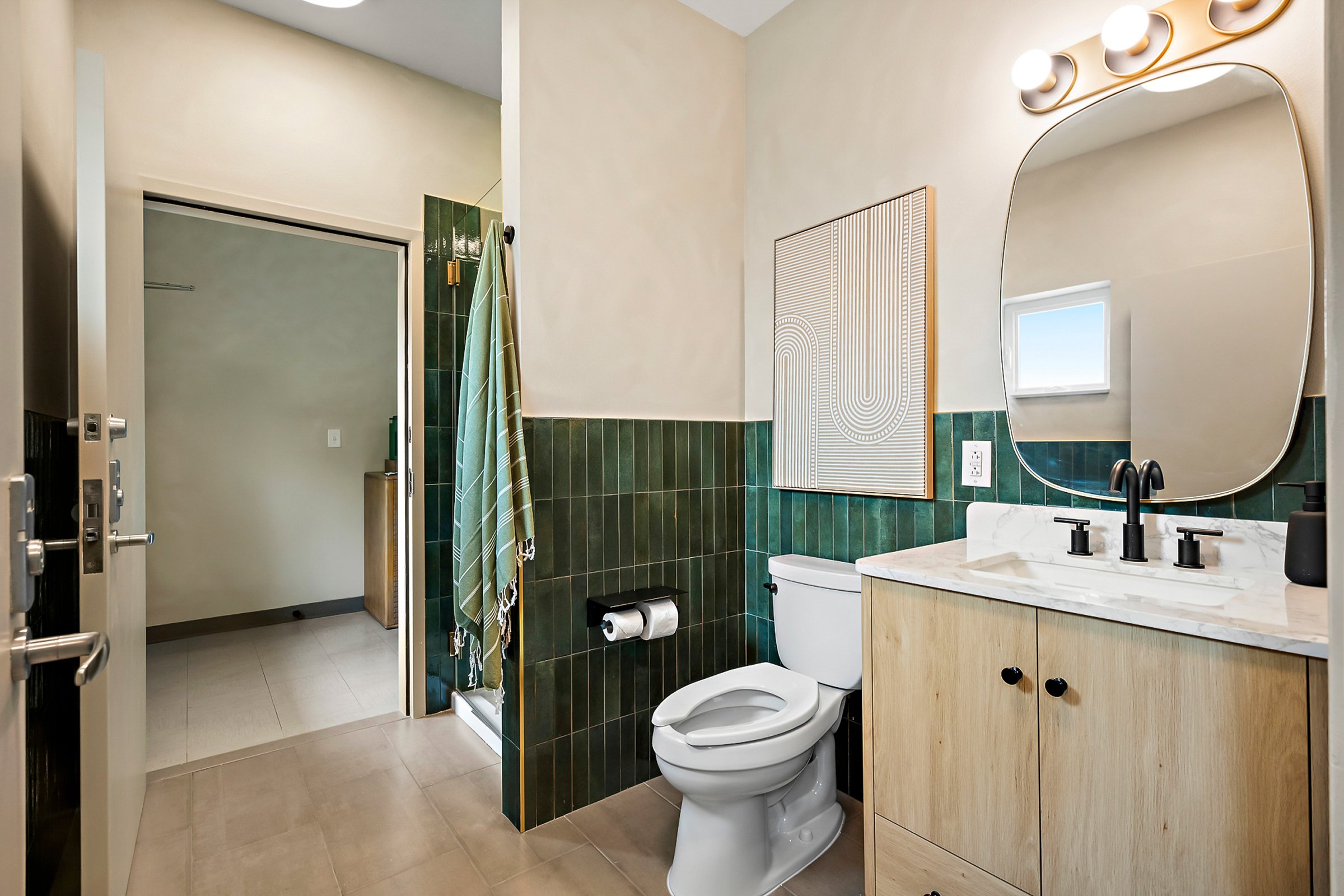 The communal bathhouse with polished concrete floors and private stalls